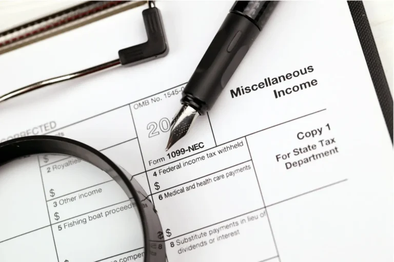 Form 1099-NEC showing miscellaneous income with pen and magnifying glass