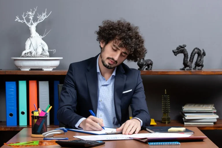 Small business owner reviewing bookkeeping reports